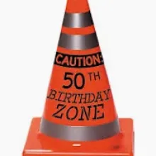 orange cone that says caution 50th birthday zone